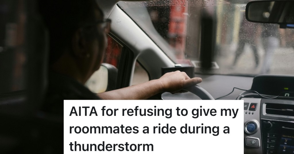 person driving a car while it's raining outside