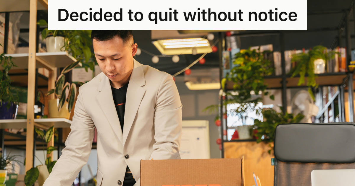 employee In suit packing up his desk