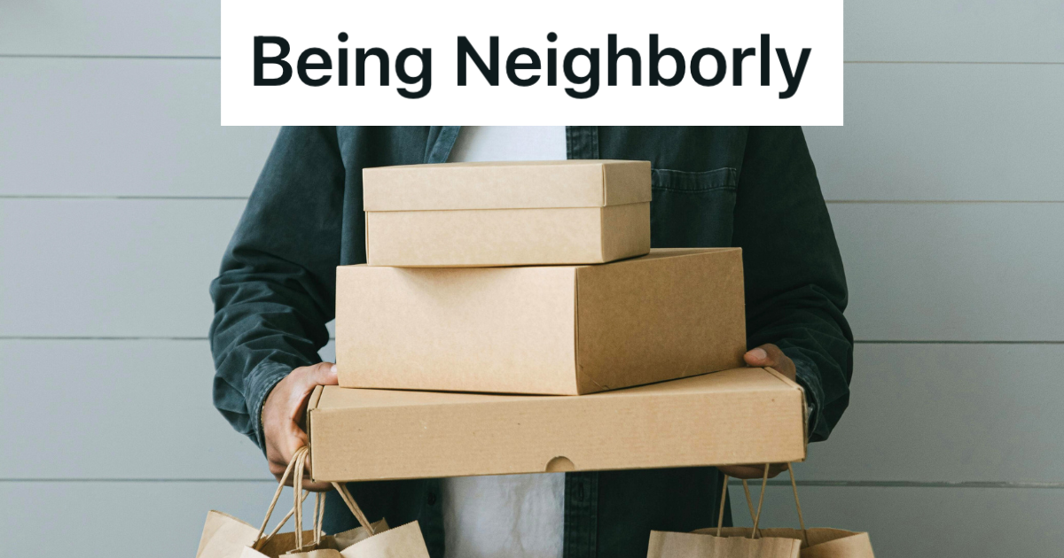 man holding stack of boxes