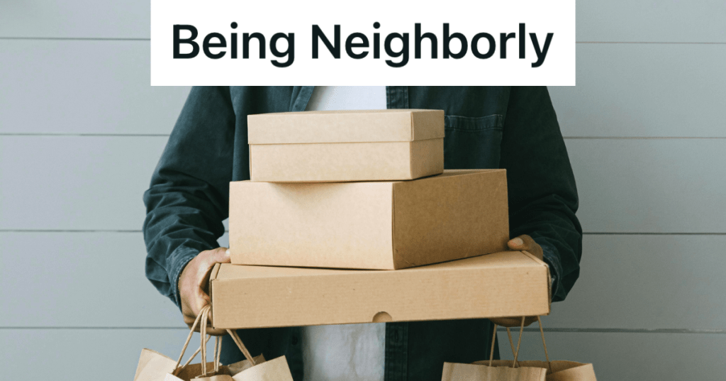 man holding stack of boxes