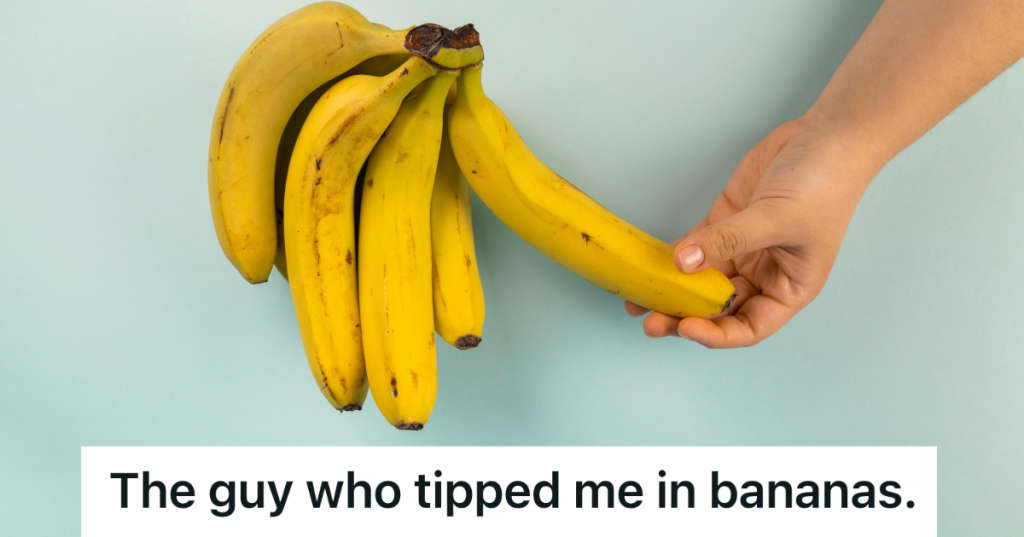 picking a banana off a bunch