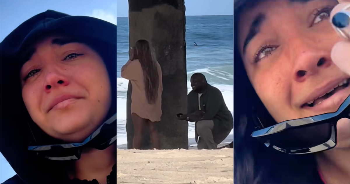 man proposing on a beach