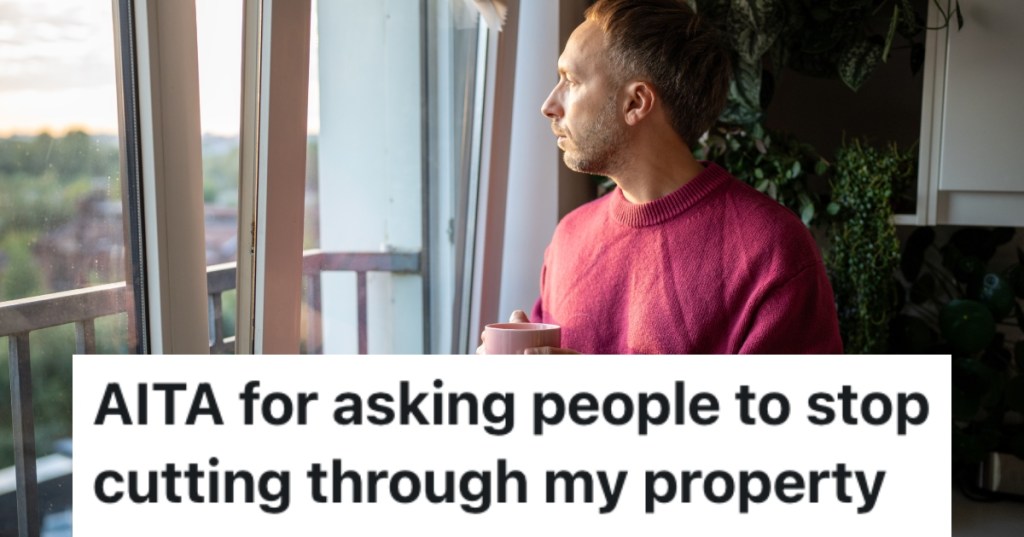 man looking out window