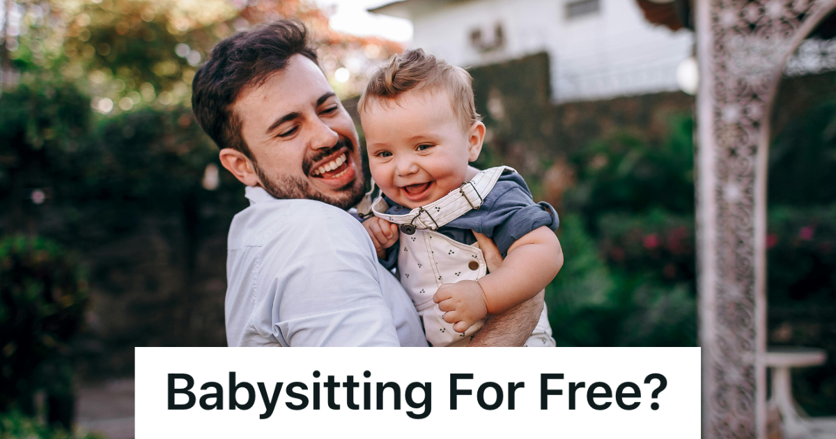 smiling man holding baby