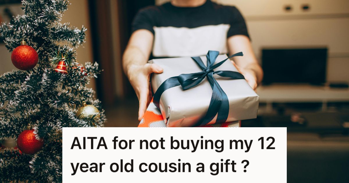 Man carrying gifts next to a Christmas tree