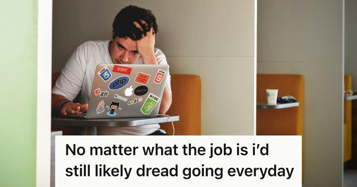 stressed man working on laptop covered in stickers