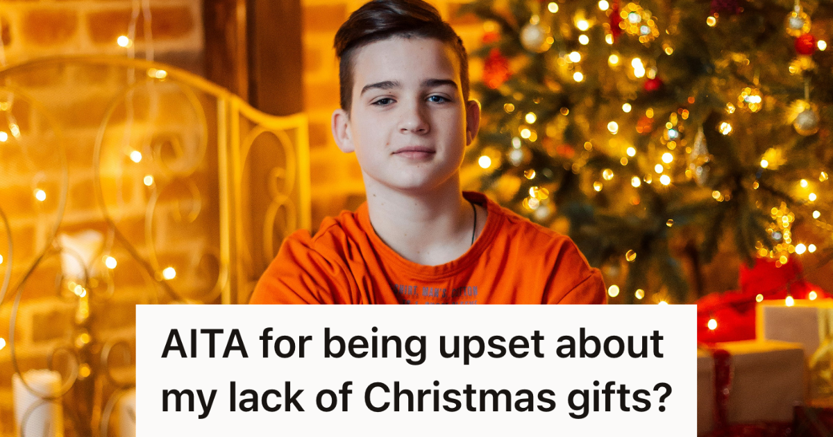 teenage boy sitting by christmas tree