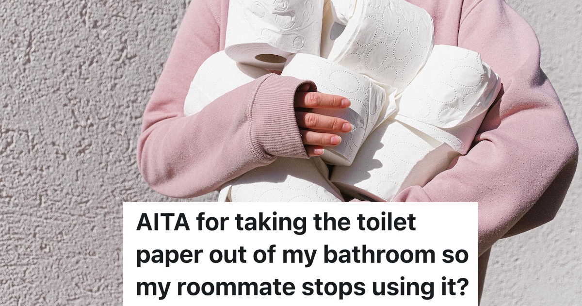 person holding several rolls of toilet paper