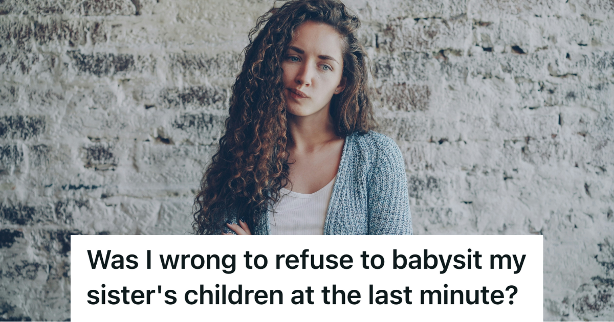upset young woman crossing arms in front of brick wall