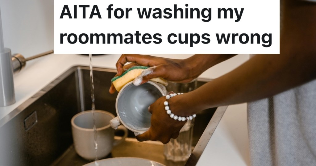 person washing a cup in the sink