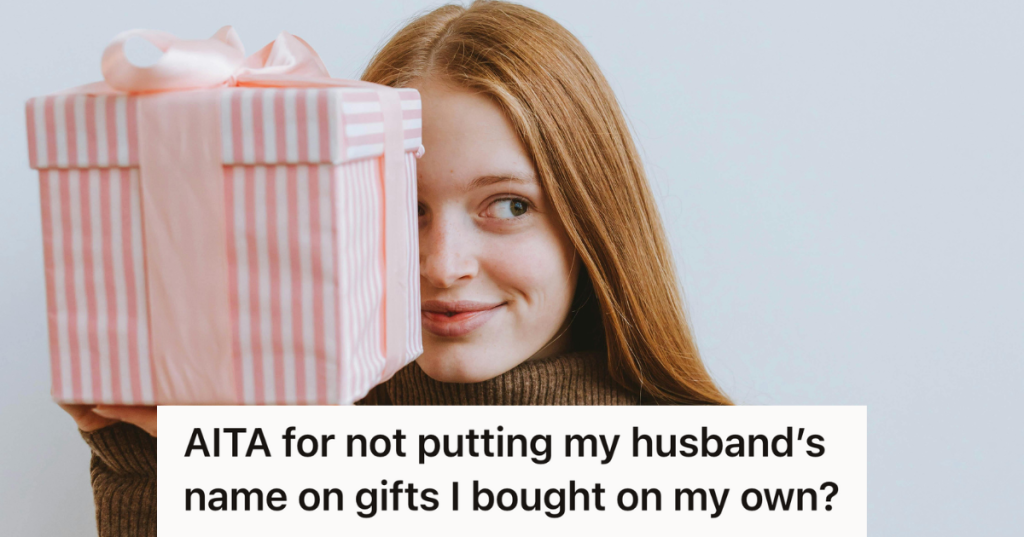 woman in sweater holding a christmas gift