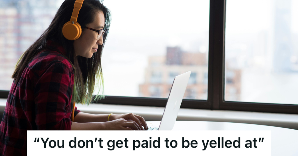 woman wearing orange headphones at her desk