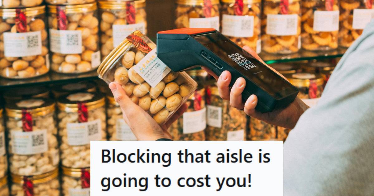 Man scanning jars of food in the grocery store