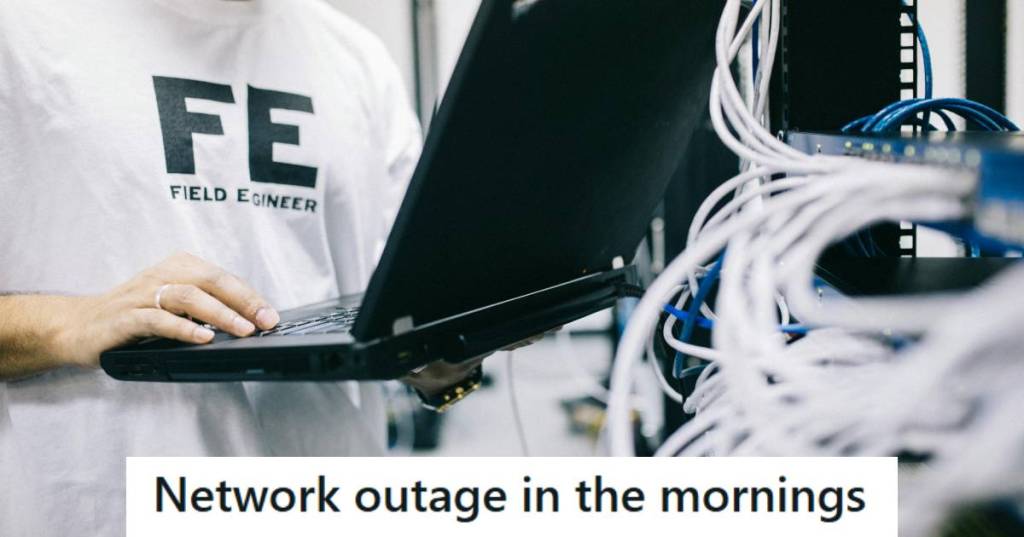 Man holding a laptop fixing the network so it won't shut off every morning