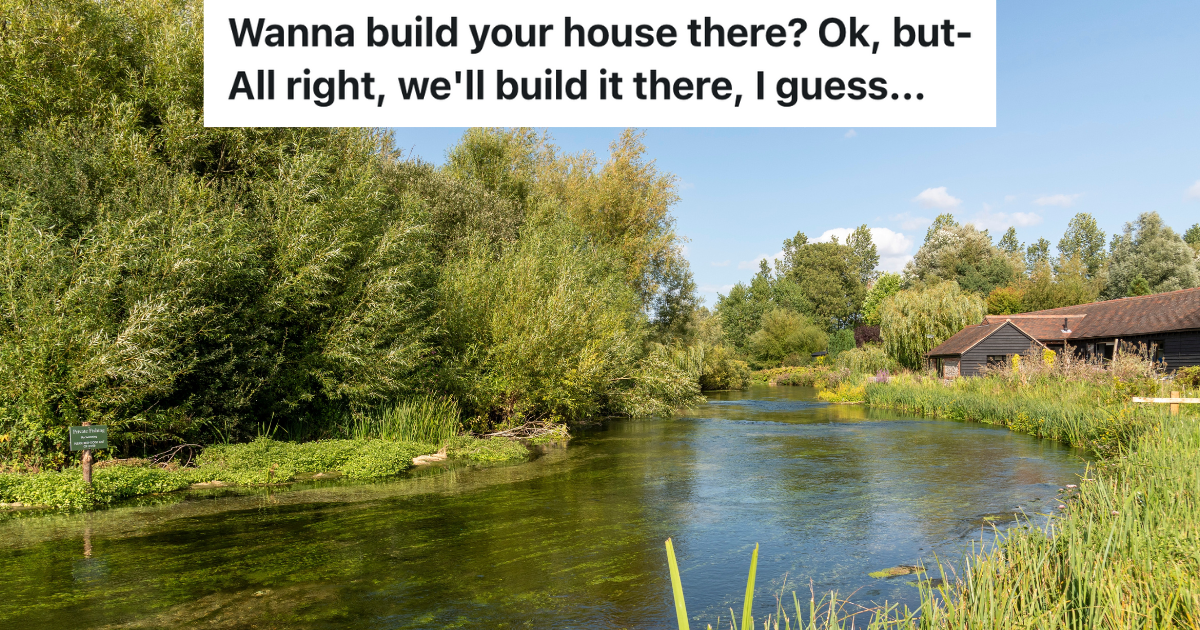 river with a house built near it in the distance