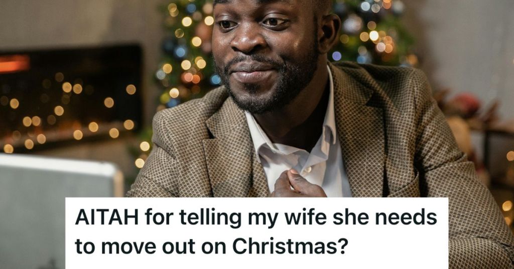 Man looking at his phone while at home on Christmas