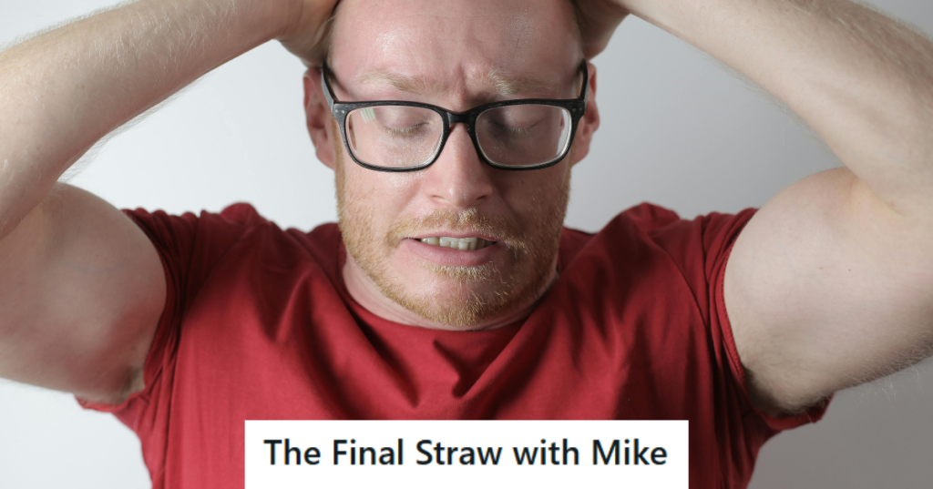 Man in red shirt looking frustrated