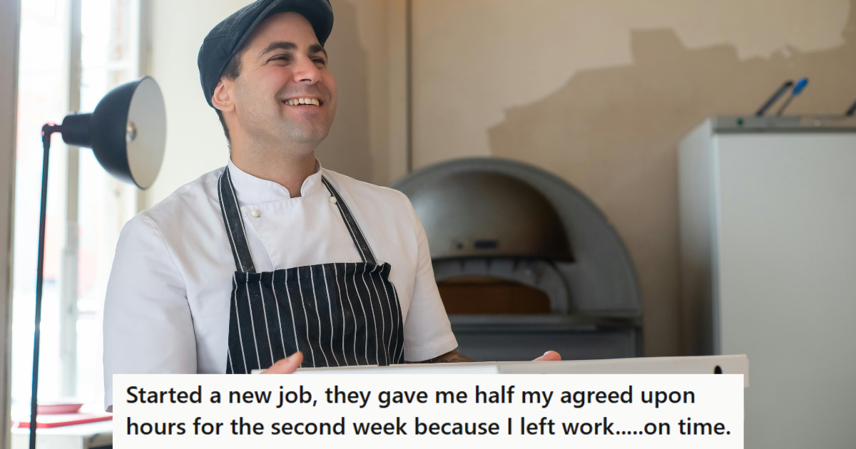 Man in apron carrying pizza boxes