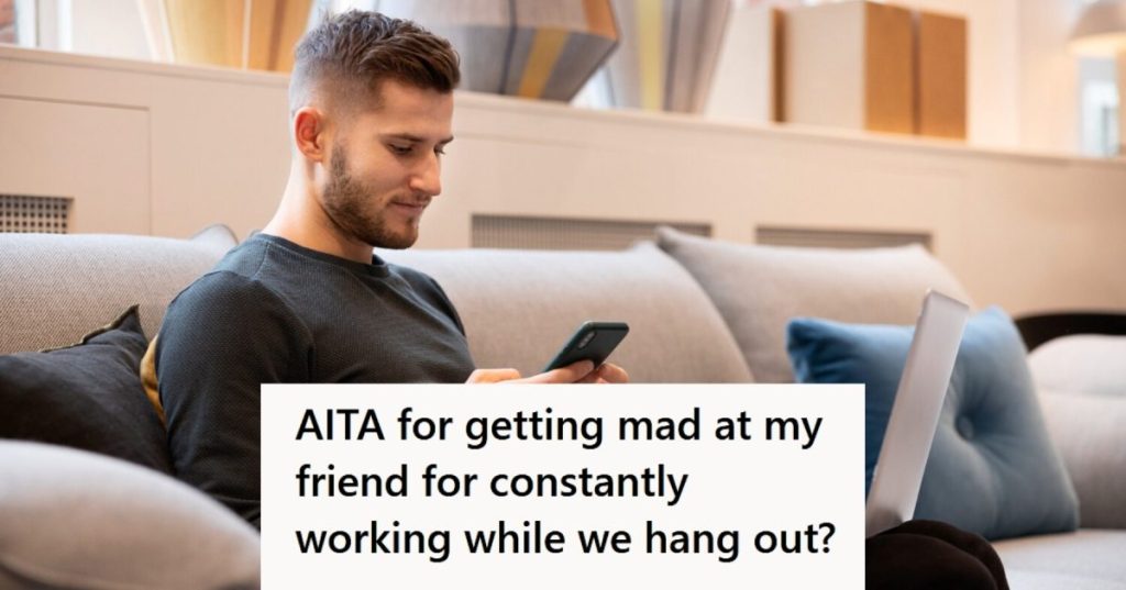 Man using his phone on the couch