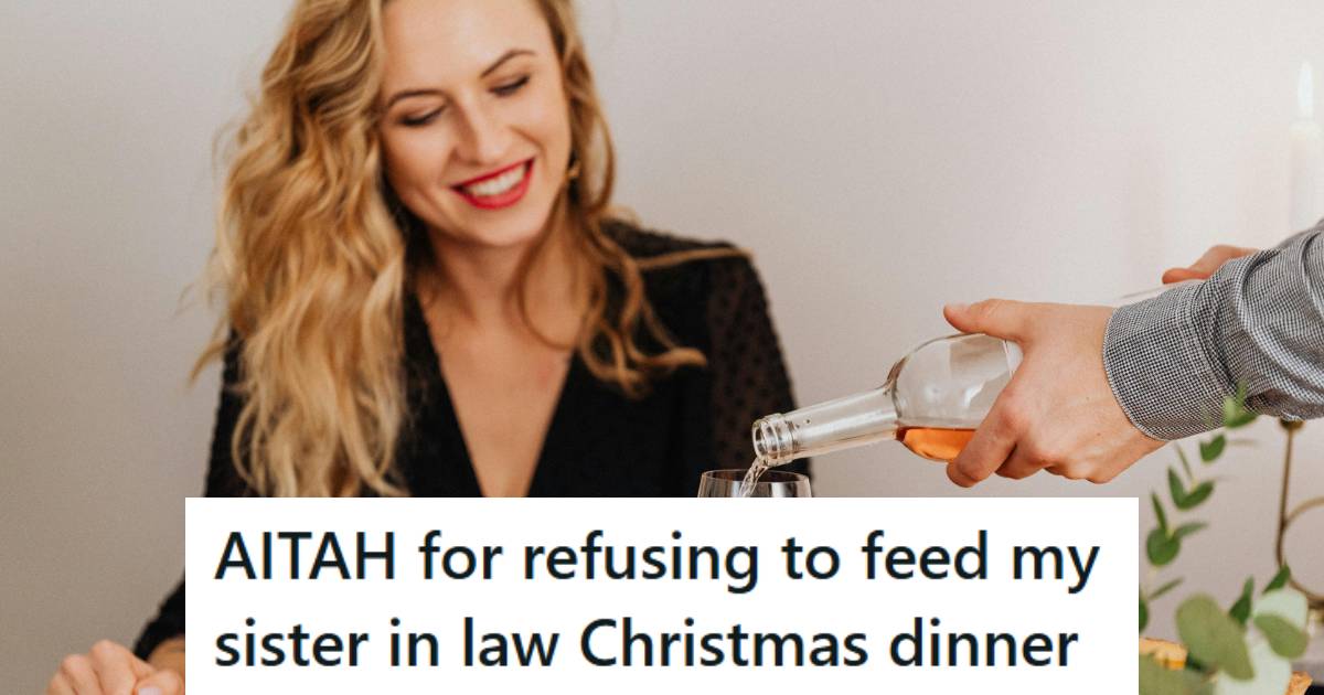 Woman smiling at a family dinner as someone is pouring her another glass of wine