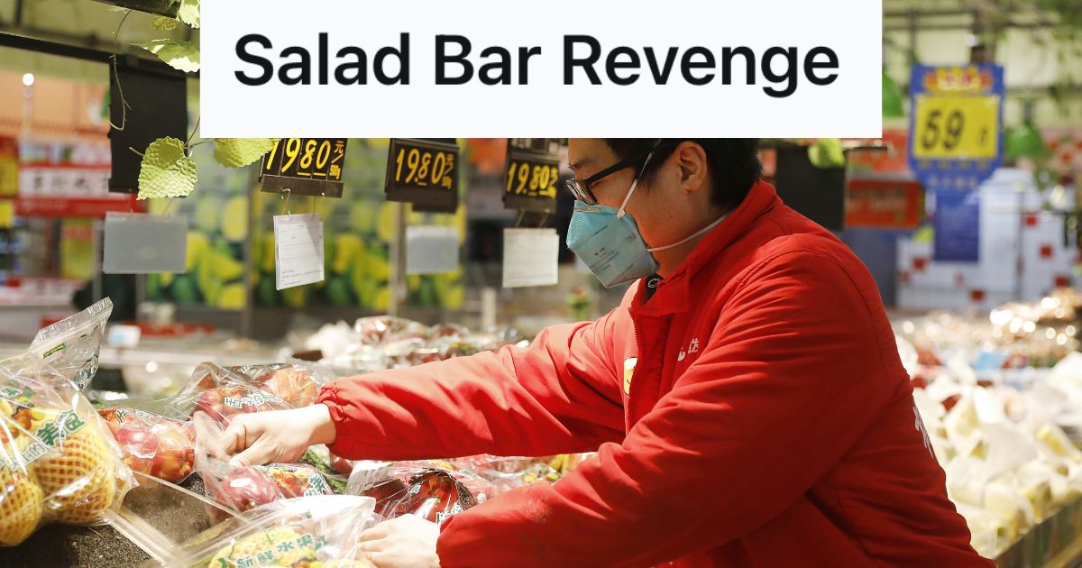 Man working in a fruit section of a store