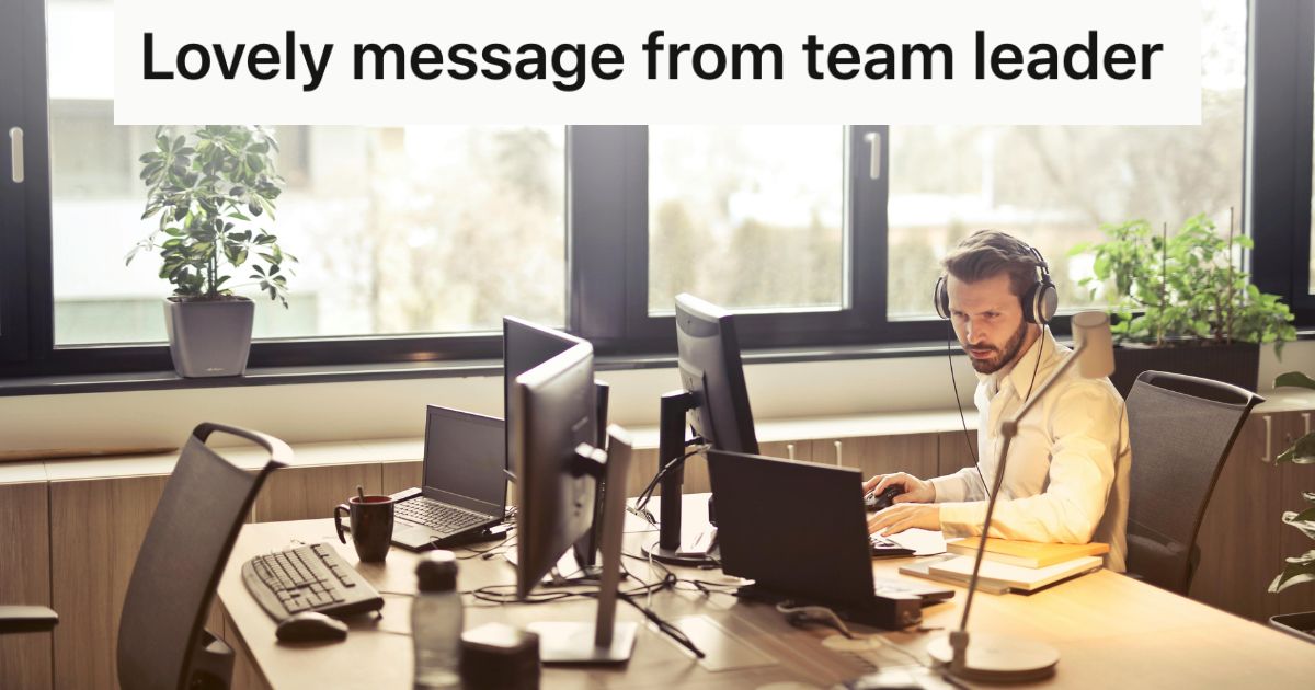 Man wearing head phones looking at a computer screen in an office