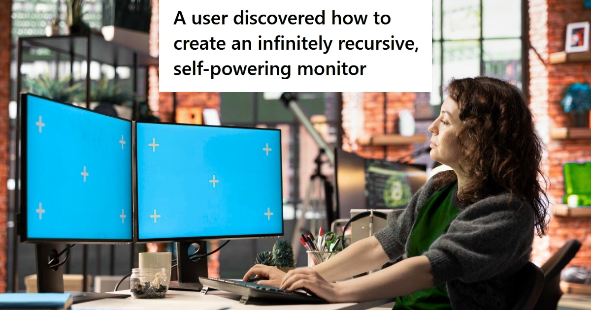 Woman using two monitors at office