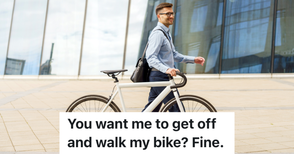 businessman walking his bicycle