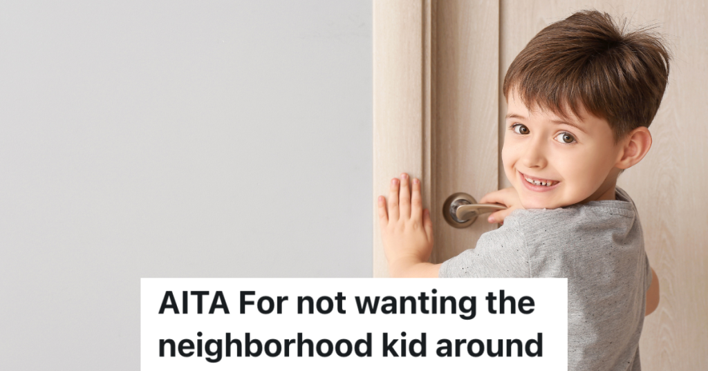 cute little boy holding door handle
