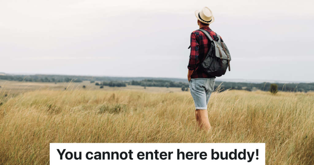 man wearing a backpack walking through a field
