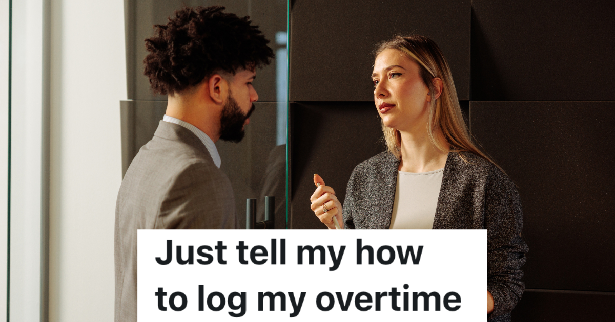 man in suit talking to female manager