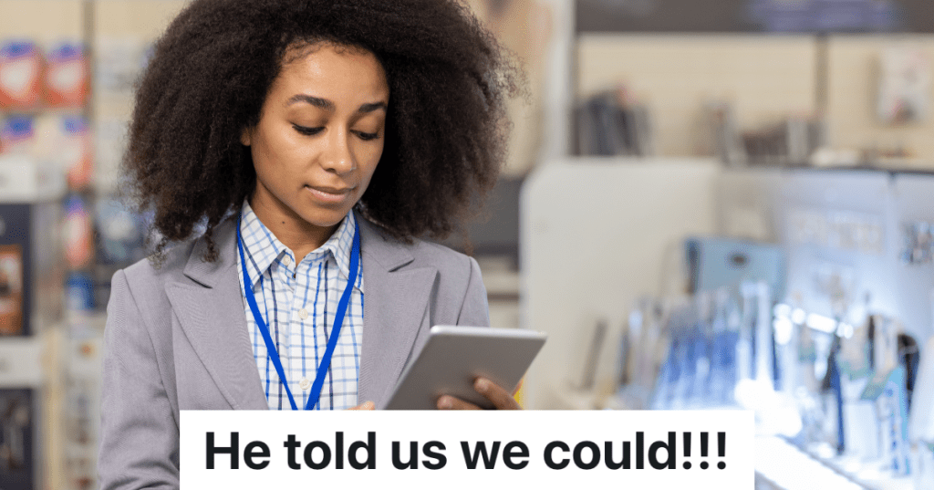 female manager at retail store looking at tablet