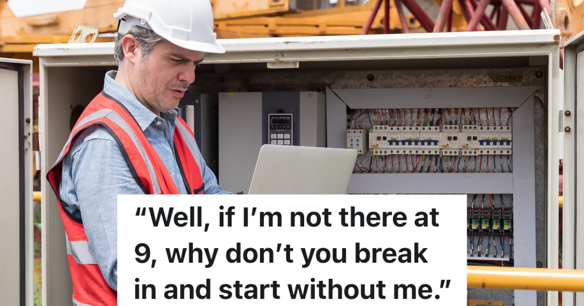 electrician looking at laptop and electrical system