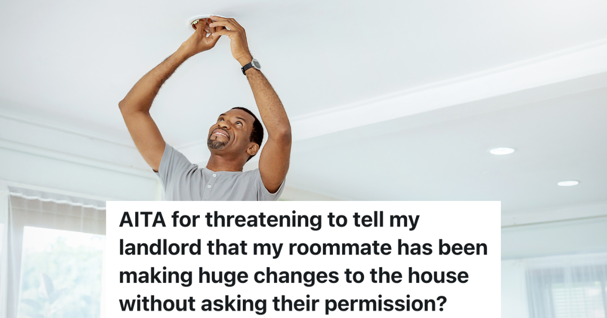 man changing ceiling light