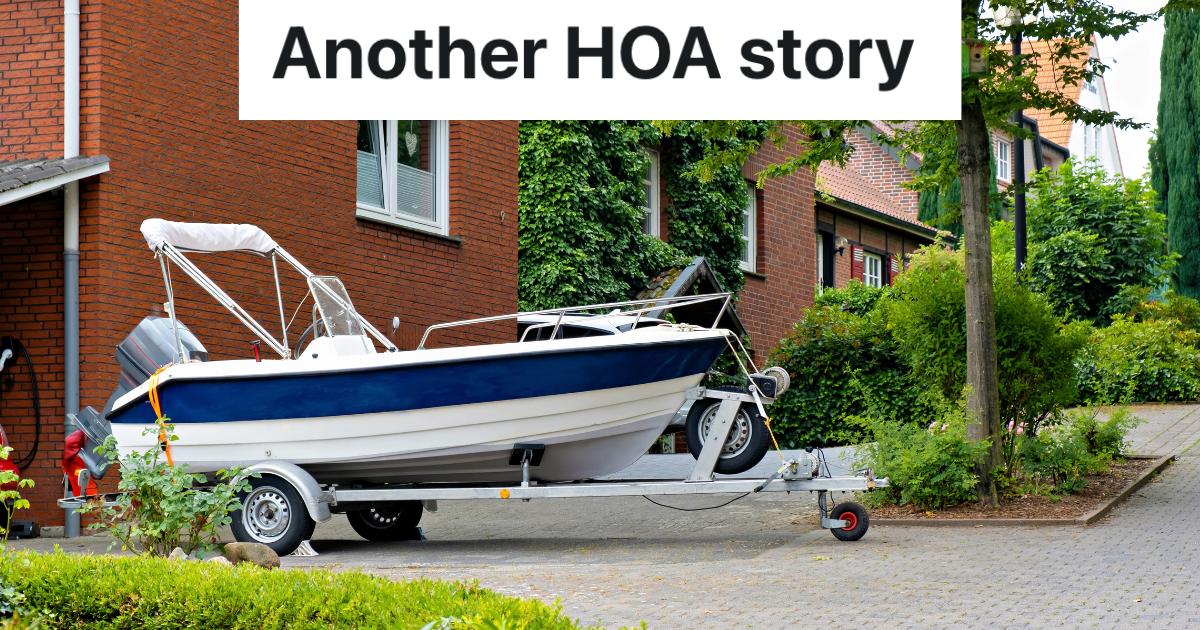 blue and white boat parked in driveway