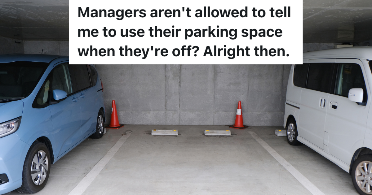 empty parking spot between two parked cars in a parking garage