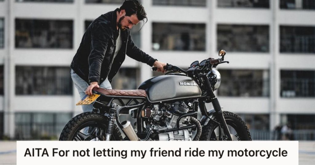 Man in black jacket parking black Honda Cafe Racer motorcycle