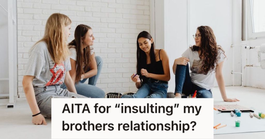 A group of girls talking to each other while doing a project