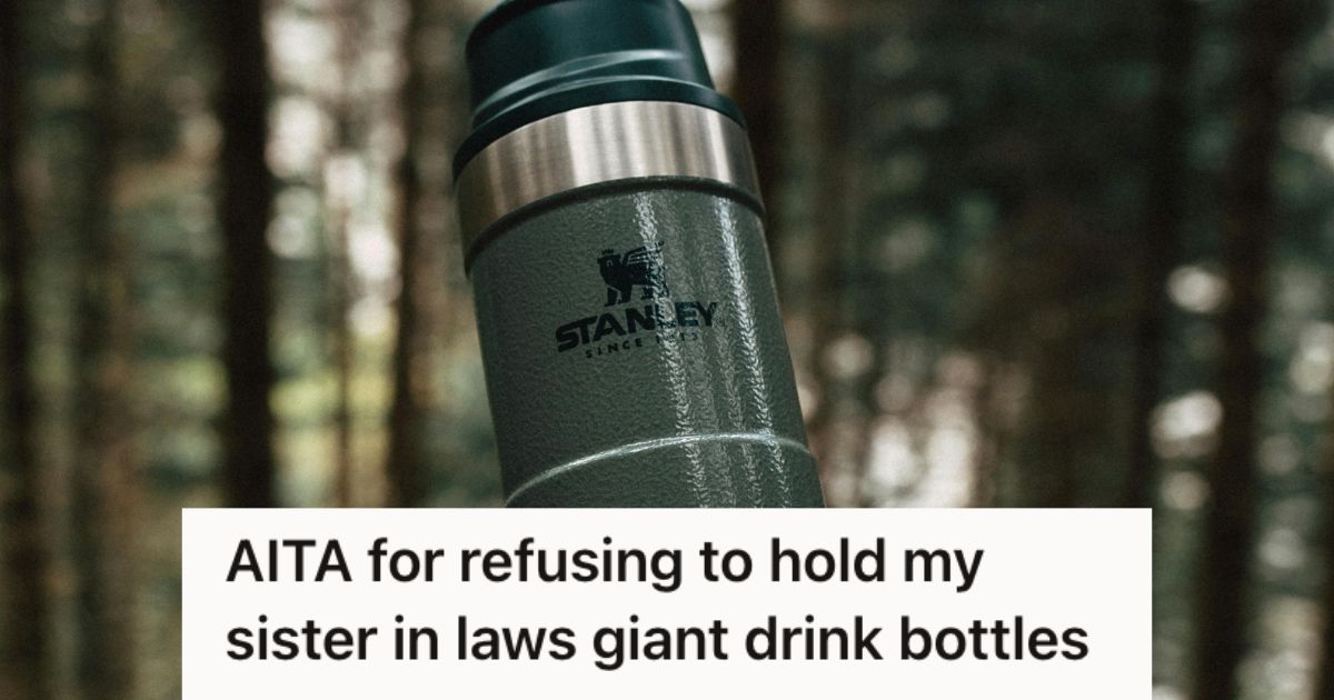 A dark green Stanley drinking water used outdoors