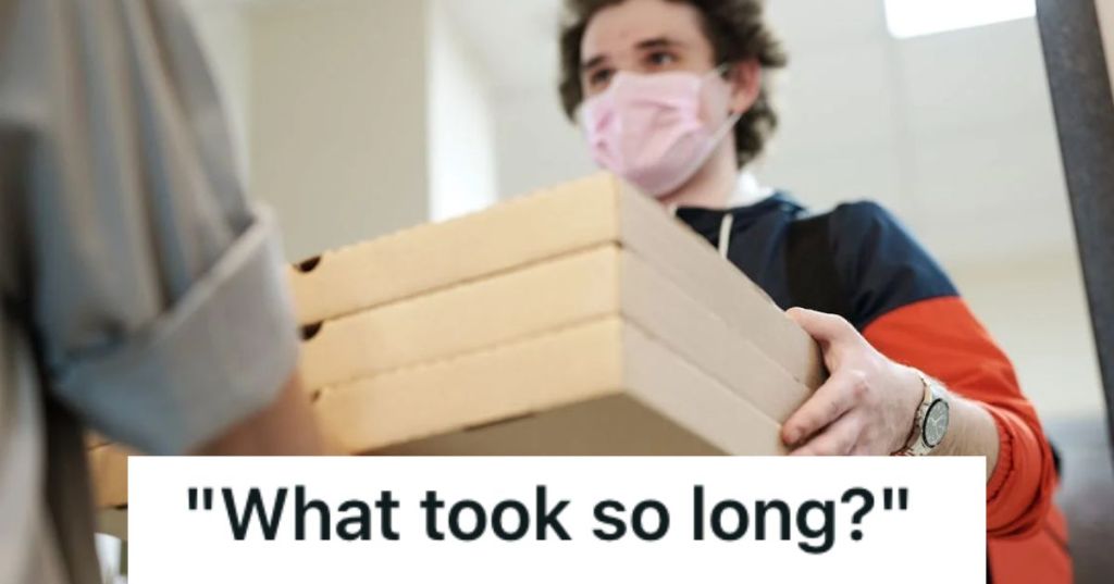 Man delivering three boxes of pizza to his customer