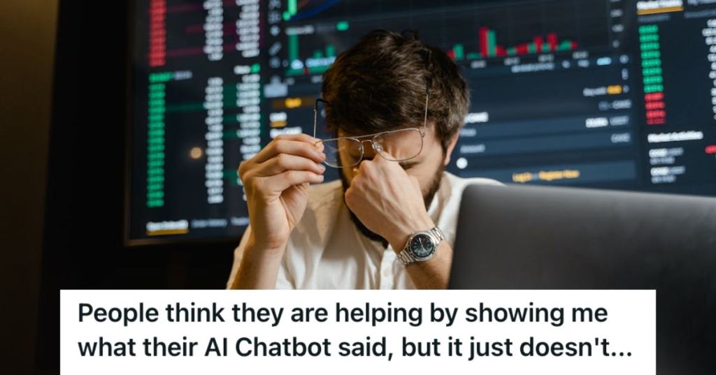 Tired employee holding his head while his eyes are closed