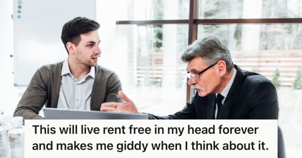 Boss talking to his male employee in the office