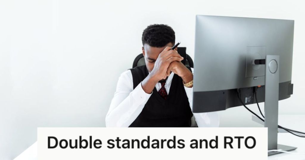 Employee in front of a computer feeling frustrated