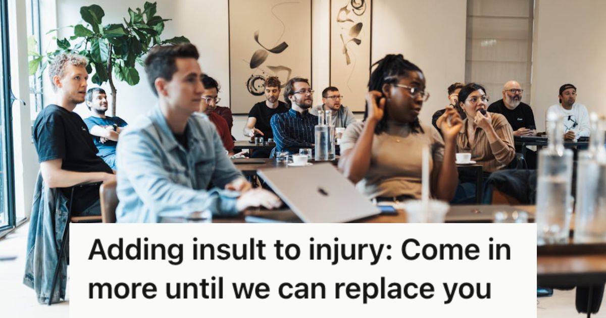 Office employees attending a meeting and listening intently