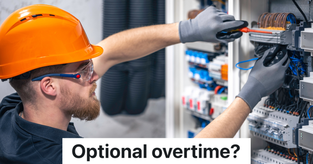 electrician in an orange hardhat working on a switchboard