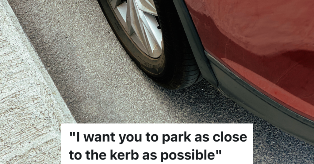 closeup of red car's tire parked close to the curb