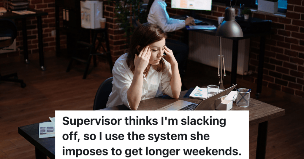stressed out employee sitting at desk in front of laptop