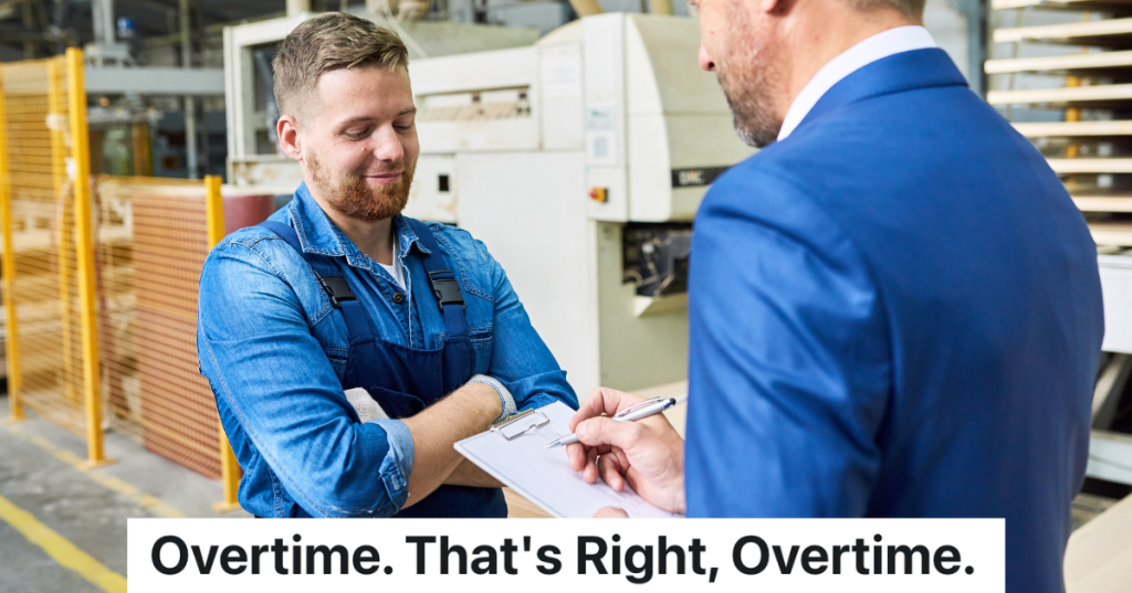 smiling factory worker with arms crossed talking to businessman holding clipboard