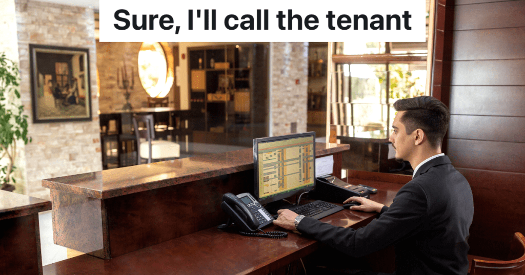 male receptionist sitting at desk in fancy building