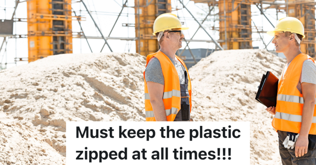 two construction workers talking on a job site